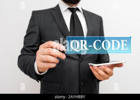 Handwriting text writing Qr Code. Conceptual photo the trademark for a type of matrix barcode A machinereadable code Male human wear formal work suit Stock Photo