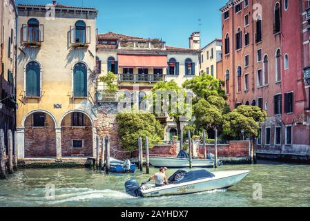 Venice, Italy - May 18, 2017: Motorboat sailing along the Grand Canal. Motor boats are the main transport in Venice. Stock Photo