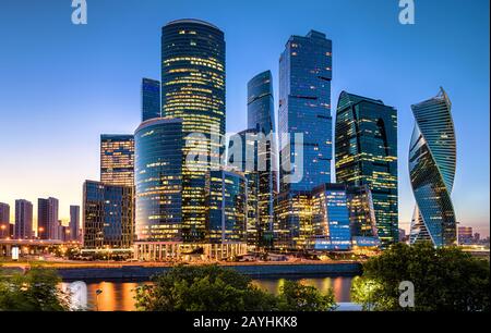 Moscow-City at night, Russia. Moscow-City is a business district at Moskva River. Evening view of commercial and residential skyscrapers. Panorama of Stock Photo