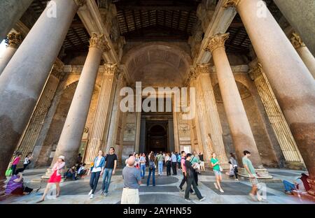 ROME - OCTOBER 2, 2012: Tourists visit the Pantheon. Pantheon is a famous monument of ancient Roman culture, the temple of all the gods, built in the Stock Photo