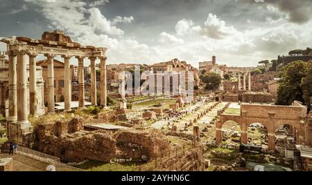 Panoramic view of the Roman Forum in Rome, Italy. The Roman Forum is the remains of architecture of the Roman Empire and is one of the main tourist at Stock Photo