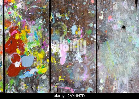 Wooden boards covered in paint creating random and abstract artistic patterns and shapes for creative background Stock Photo