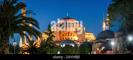 Hagia Sophia at night, Istanbul, Turkey. It is a top landmark of Istanbul. Panoramic view of the ancient Hagia Sophia or Aya Sofya in evening. Old arc Stock Photo