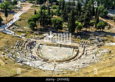 Aerial panoramic view of the Theatre of Dionysus at the foot of Acropolis in Athens, Greece. It is one of the main landmark of Athens. Scenic panorama Stock Photo