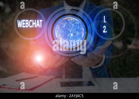 Text sign showing Webchat. Business photo text system that allows users to communicate in real time using internet Elements of this image furnished by Stock Photo