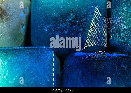 Illuminated ice block rich in frozen texture - contemporary abstract macro background in blue tones Stock Photo