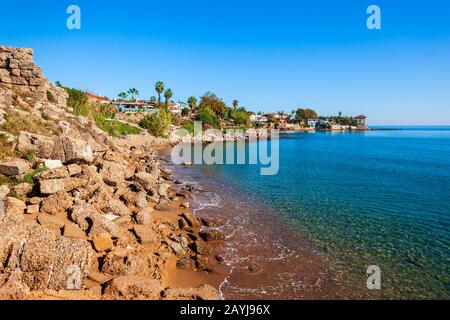 Rocky beach in the centre of Side town, situated in Antalya region on the southern Mediterranean coast of Turkey. Stock Photo