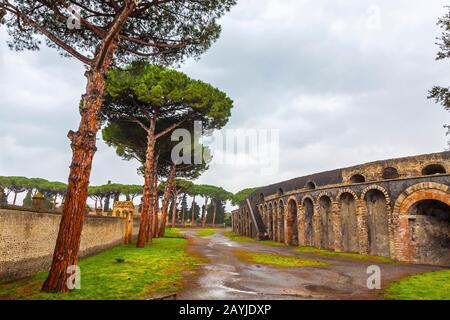 Ancient Roman city of Pompei, Italy. Amphitheatre on the right. It's the oldest surviving Roman Amphitheatre. Pompei was destroyed and buried with ash Stock Photo