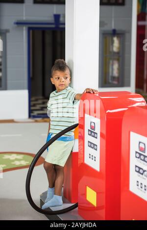 Gas station game for kids in playroom. Stock Photo