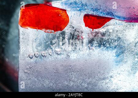 Illuminated ice block rich in frozen textures - contemporary abstract macro background Stock Photo