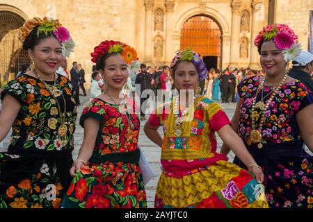 Women posing dressed in regional costumes in the city of Oaxaca de Juarez, Oaxaca, Mexico. Stock Photo