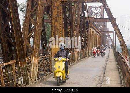 Hanoi Long Bien bridge - Motorists ride accross the historic Long Bien bridge in Hanoi, Vietnam, Southeast Asia. Stock Photo