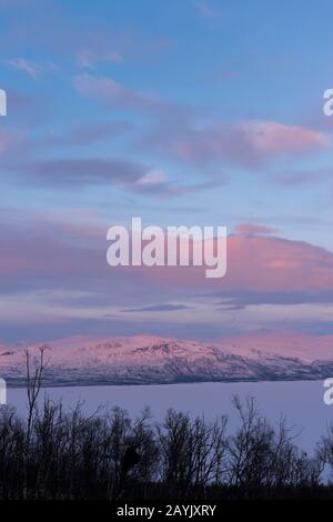 View from the Hotel Fjallet area of frozen and snow-covered Lake Tornetrask in Swedish Lapland, northern Sweden. Stock Photo