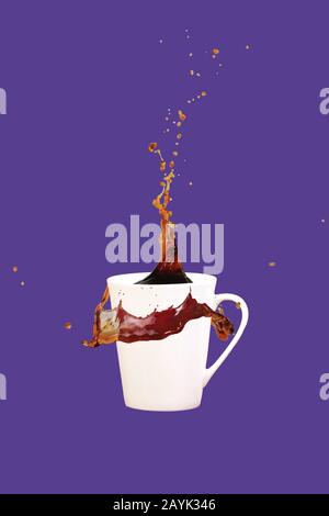 Levitating coffee mug with splashes. Coffee concept. Minimal art trend. Solid ultra violet background. Vertical, straight cup Stock Photo