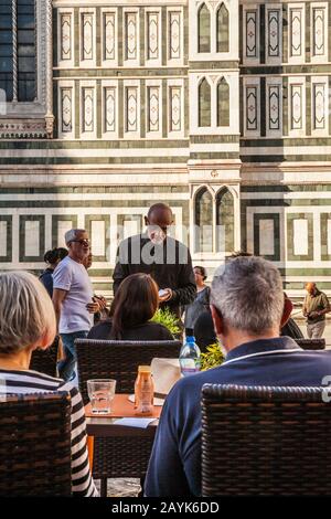 A waiter taking orders at an outdoor cafe, Piazza del Duomo, Florence, Italy. Stock Photo