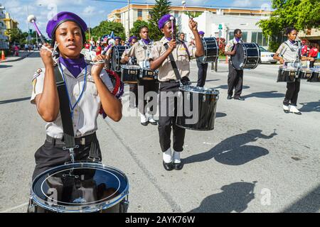 Miami Florida,North Miami,Winternational Thanksgiving Day Parade,NE 125th Street,local celebration,Black student students marching,drum corp,beret,cym Stock Photo