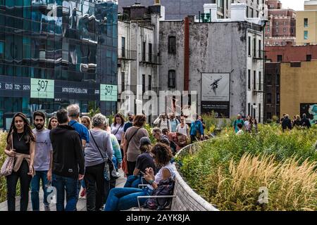 NEW YORK, USA - OCTOBER 07: This is a view of people walking along the footpath at the High Line Park, a popular travel destination on October 07, 201 Stock Photo