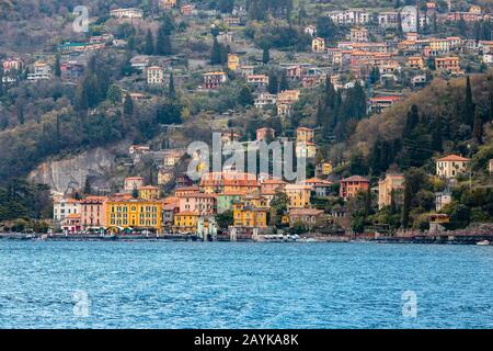 Evening view city Bellagio and Varenna Como water lake Italy blue sky mountain Stock Photo