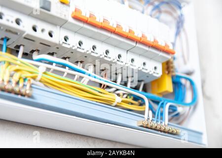 Close up elements copper wires consumer electric control panel switchboard enclosure for distribution and power electricity Stock Photo