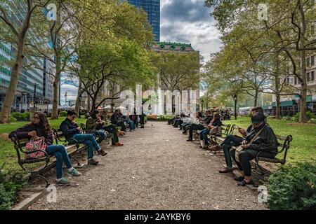 NEW YORK, USA - OCTOBER 10: This is Bowling Green Park in the Manhattan financial district, it is the oldest public park in the city on October 10, 20 Stock Photo