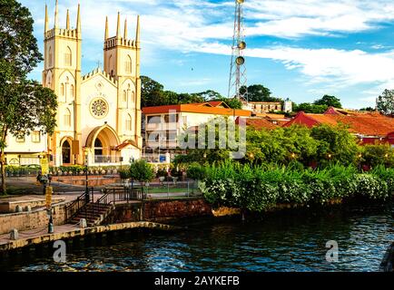 Malacca, Malaysia - June 11 2017. Church of St. Francis Xavier along the canal. Stock Photo