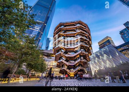 NEW YORK, USA - OCTOBER 13: This is an evening view of the architecture of The Vessel, a modern landmark structure at Hudson Yards on October 13, 2019 Stock Photo