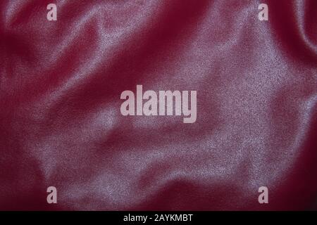 Leather burgundy background with pleats. Red Leather Texture Background Stock Photo