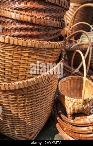 Different rattan weave items in handicraft shop Stock Photo