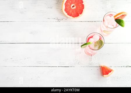 Sea Breeze Cocktail or Paloma Cocktail with grapefruit, lime and ice cubes, copy space. Summer brunch refreshing citrus cocktails. Cold infused citrus Stock Photo