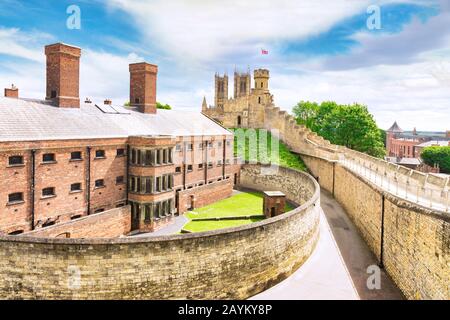 2 July 2019: Lincoln, UK - The old gaol, now a tourist attraction, from the walls of the castle. The cathedral  towers can be seen in the background. Stock Photo