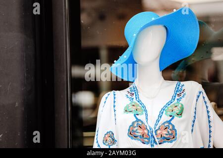 Female mannequin with big hat Stock Photo