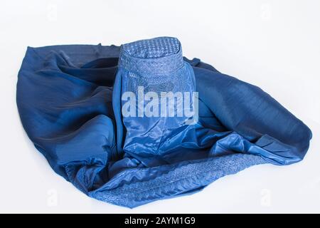 Blue burqa on white background, traditional women's clothing from Afghanistan and Pakistan Stock Photo