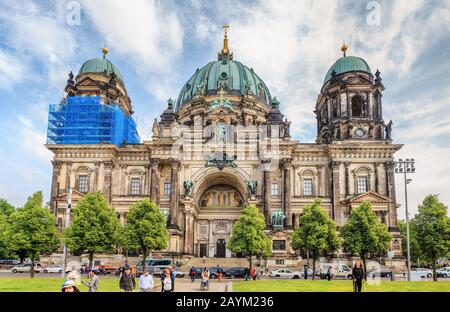 17 MAY 2018, BERLIN, GERMANY: Crowds of people tourists near main landmark and symbol of Berlin - Berliner Dom cathedral on Museum Island Stock Photo