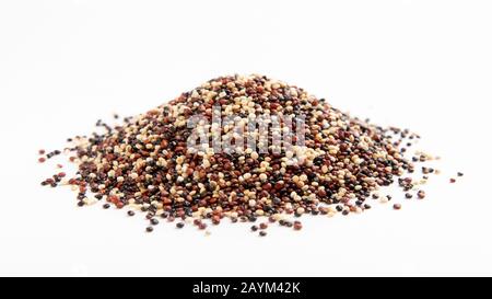 Heap of red, white and black quinoa seeds Stock Photo