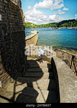 Hall Walk links Fowey and Polruan in Cornwall and is of exceptional beauty through woodland and creek and encompasses the  green waters of Pont Stock Photo