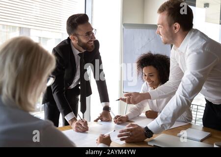Diverse businesspeople working together on common business project finances Stock Photo