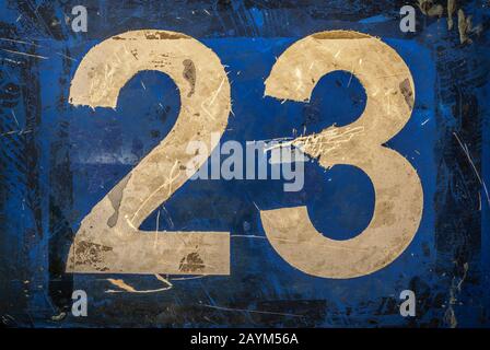Shabby Scratched Old Painted Number On A Matte Plastic Surface Of The Sheet Board. Stock Photo