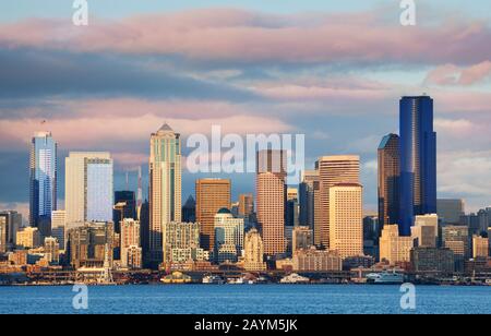 Seattle waterfront downtown buildings skyline view at evening sunset on spring day, Washington, USA Stock Photo