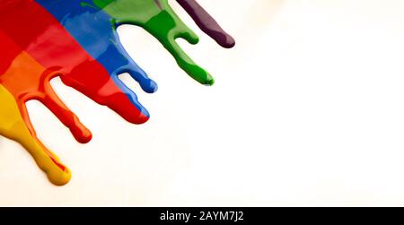 Colorful paint dripping isolated on a white background Stock Photo