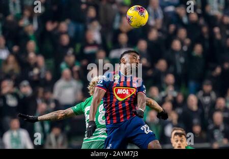 Ivan Petryak of MOL Fehervar FC dribbles between Franck Boli of