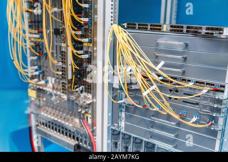 closeup of fiber optical network router, ports and cables, internet and technology concept Stock Photo