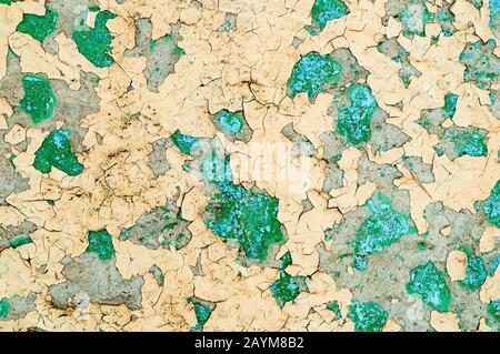 Texture concrete industrial background - light yellow and green peeling paint on the old rough concrete surface, peeling paint texture Stock Photo