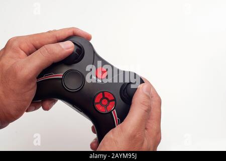 Radio remote controller holded by hands isolated in white background Stock Photo