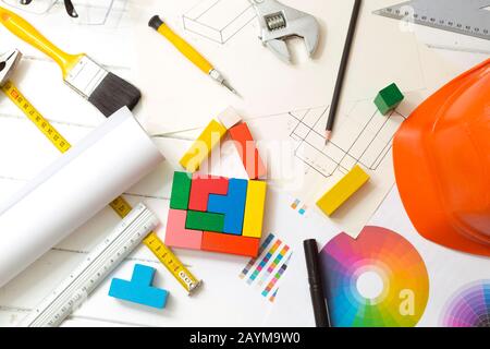 Designing the interior of the house, decor equipment. Construction tools, sketch on the desktop of a builder engineer. Stock Photo