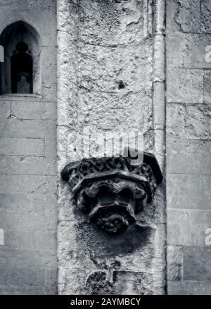 decaying stonework on the outside of an ancient church in France Stock Photo
