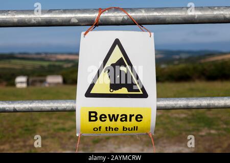 A Beware of the Bull warning sign on a farm in the U.K. Stock Photo