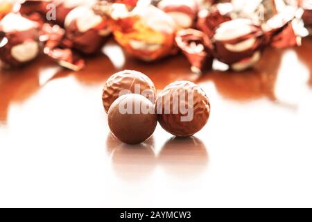 wrapped multi colored foil chocolates Stock Photo