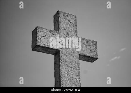 Stone cross in cemetery, christianity and catholic Stock Photo