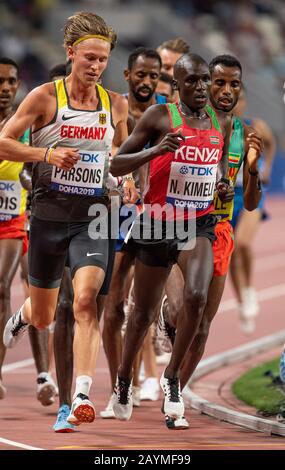 DOHA - QATAR - SEP 27: Sam Parsons (GER) and Nicholas Kipkorir Kimeli (KEN) competing in the Men's 5000m heats during day one of 17th IAAF World Athle Stock Photo