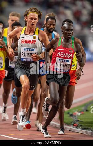 DOHA - QATAR - SEP 27: Sam Parsons (GER) and Nicholas Kipkorir Kimeli (KEN) competing in the Men's 5000m heats during day one of 17th IAAF World Athle Stock Photo